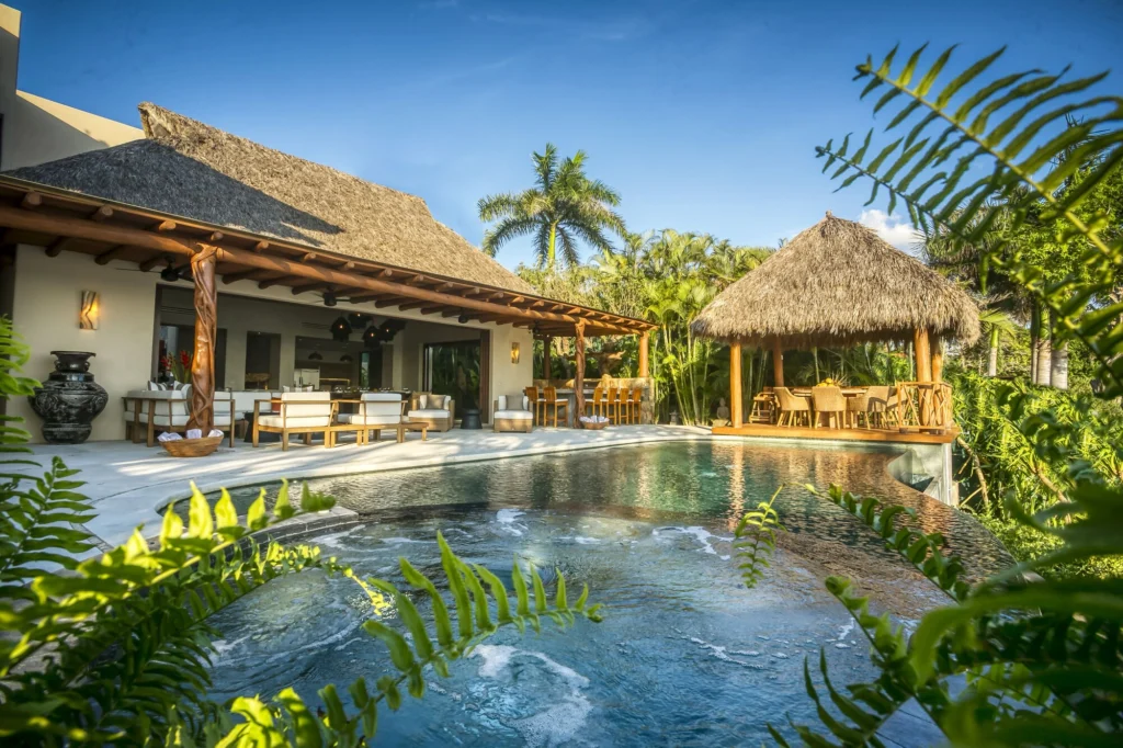Infinity pool and circular spa at Casa Dewi beside the covered lounge and palapa pavilion